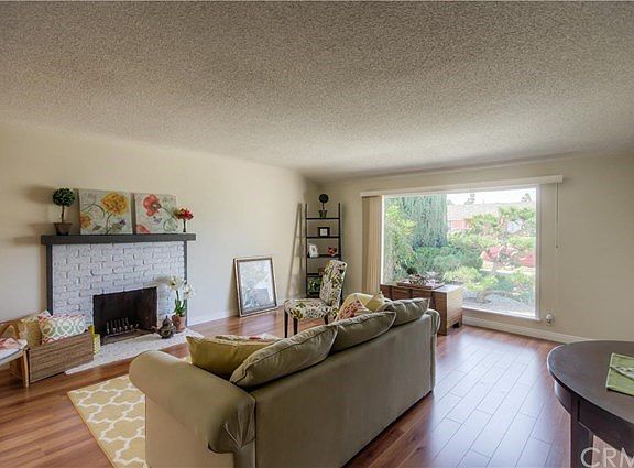 Imagine sitting in front of the fireplace / television in the oversized living room, natural light streaming through the large picture window.