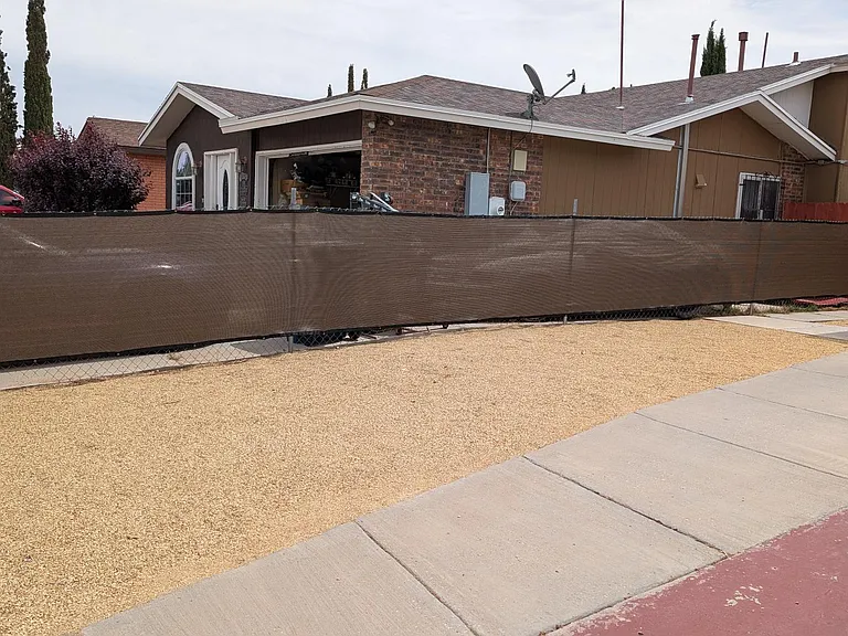 Privacy screen attached to chain link fence.