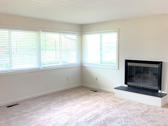 Living room with wood burning fireplace