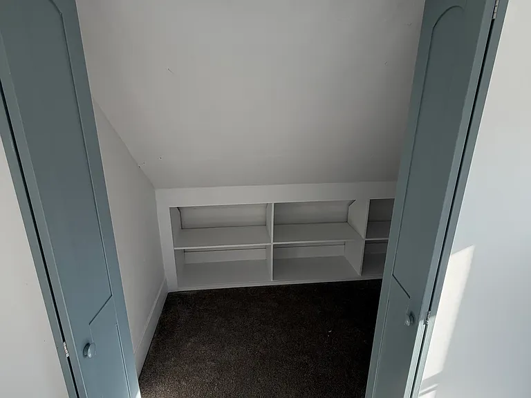 Inside the closet you have shelving plus clothes poles