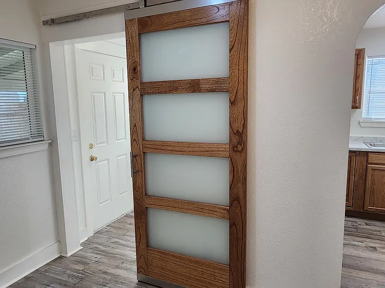 Door to laundry on left, kitchen on right
