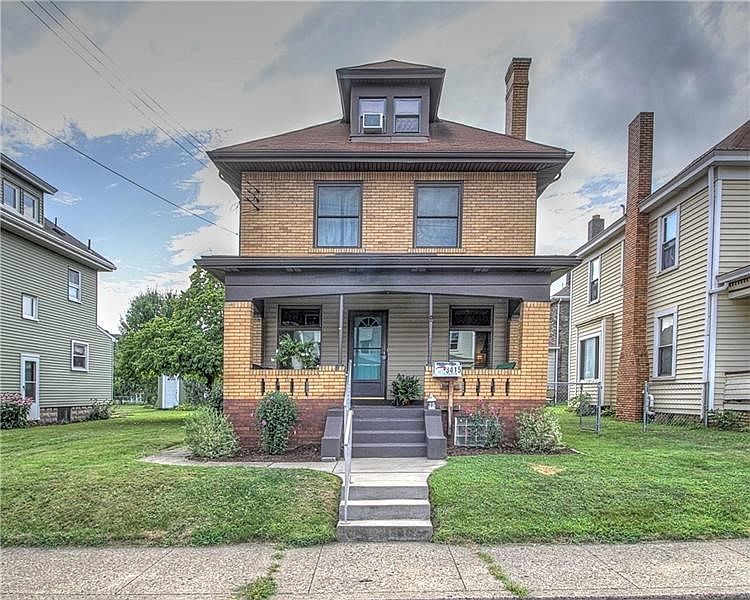 Handsome, all brick 3-story home in the heart of College Hill. Concrete sidewalks and a covered front porch great for storm-watc