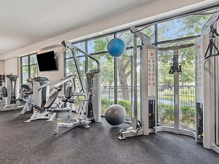 Fully-equipped fitness center with cardio and weight equipment