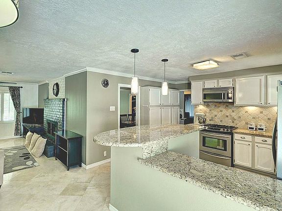 Adorable fireplace in the living room as well as extra storage in the kitchen!