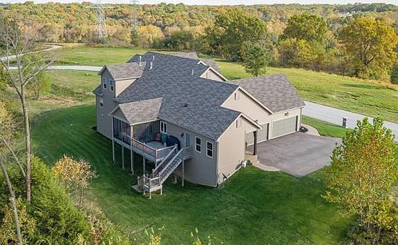 This home offers private serenity with incredible views and is only minutes from Hwys and Shopping !! This backyard also extends into the woods