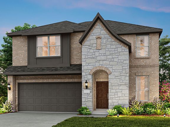 The Puma, a two-story home with 2-car garage, shown as Home Exterior B