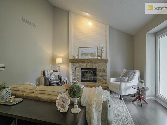 New hardwood floors and ship lap accent above fireplace