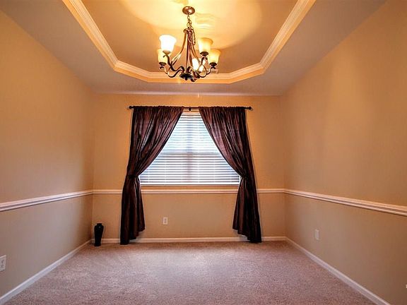 Just off to the right of kitchen is the elegant large separate dining room with trey ceilings.