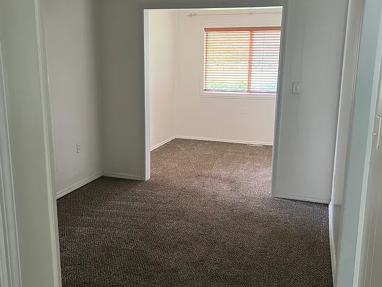 Dining area and sunroom area in the back