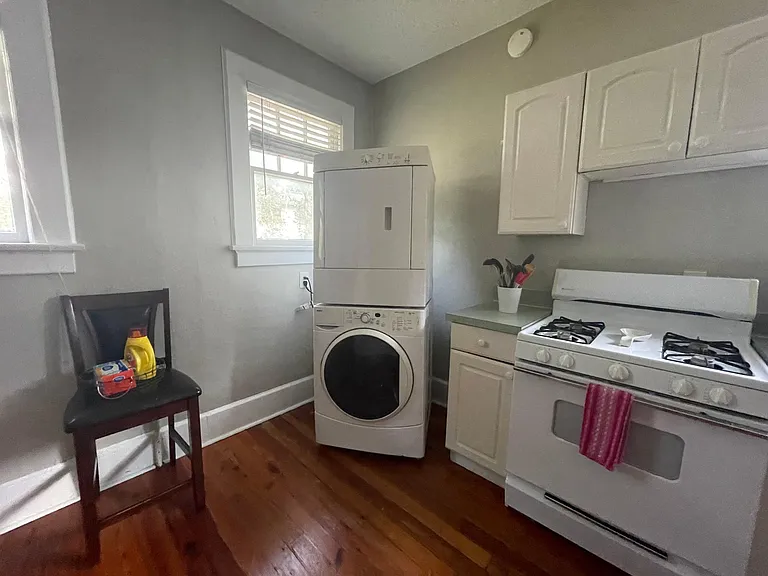 Laundry is at the back of the home (back of the kitchen).