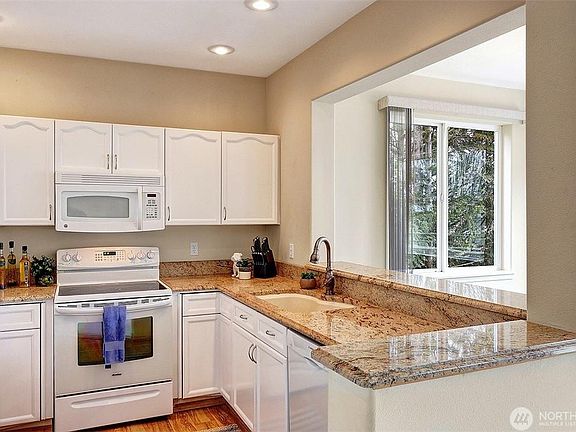 Open kitchen with dishwasher and nice mountain views