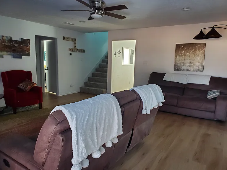 Living room with multiple seating options.