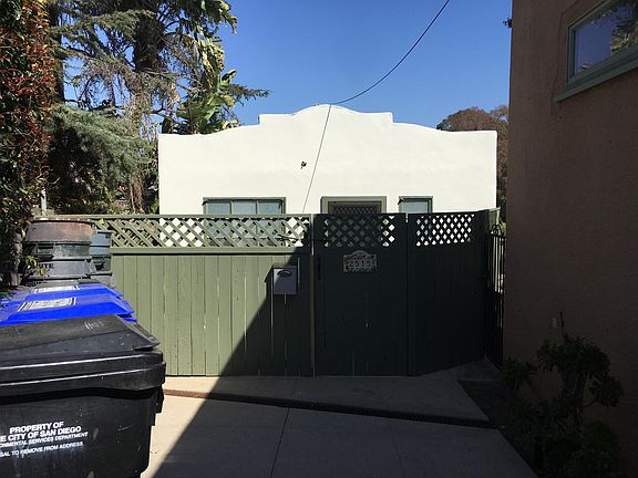 Front entrance of studio with private fenced patio