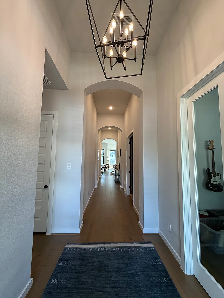 View from entry. Office on the right and bedroom with closet and bathroom on the left. - 5014 Bent Tree Dr