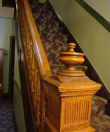 Wide hall with wooden banister