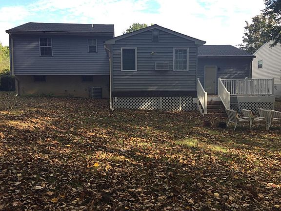 Large rear yard with trees