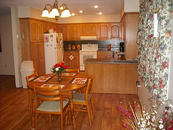 View of Breakfast/ Kitchen Area : Custom-built solid oak cabinets.