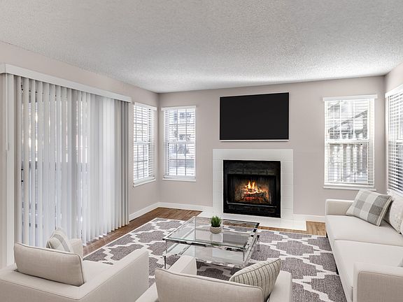 Living room fireplace at Arcadia Apartment Homes in Centennial, CO