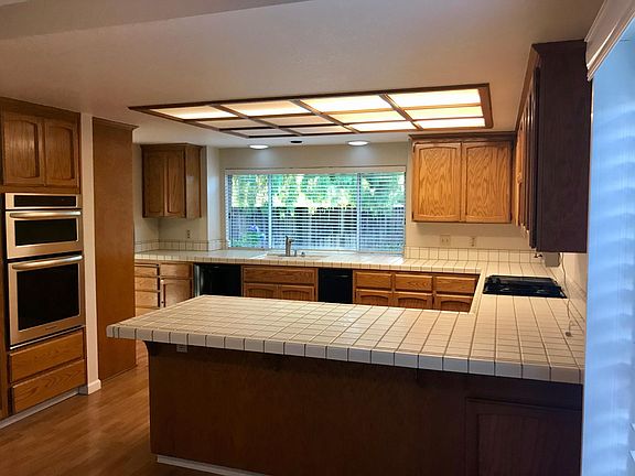 Large kitchen with view of backyard,
