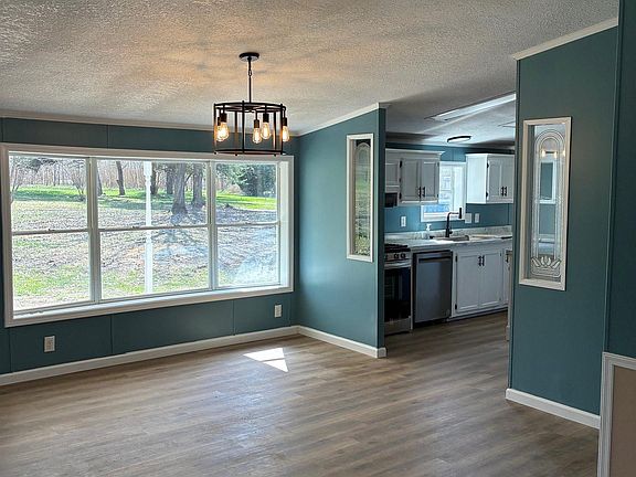 4th image of 5817 N Rod And Gun Club Rd