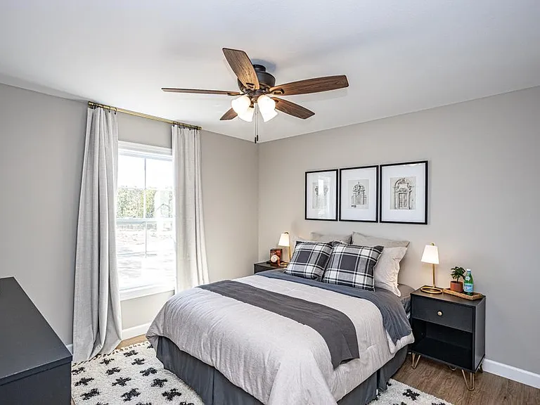 Spacious third bedroom with large window and roomy closet