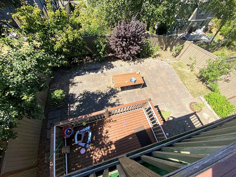 View to backyard from upper balcony