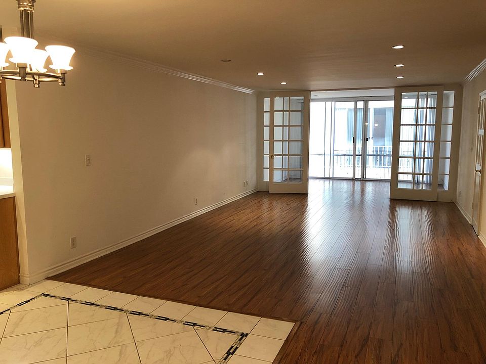 Living Room looking into the Den (separated by Double French Doors)