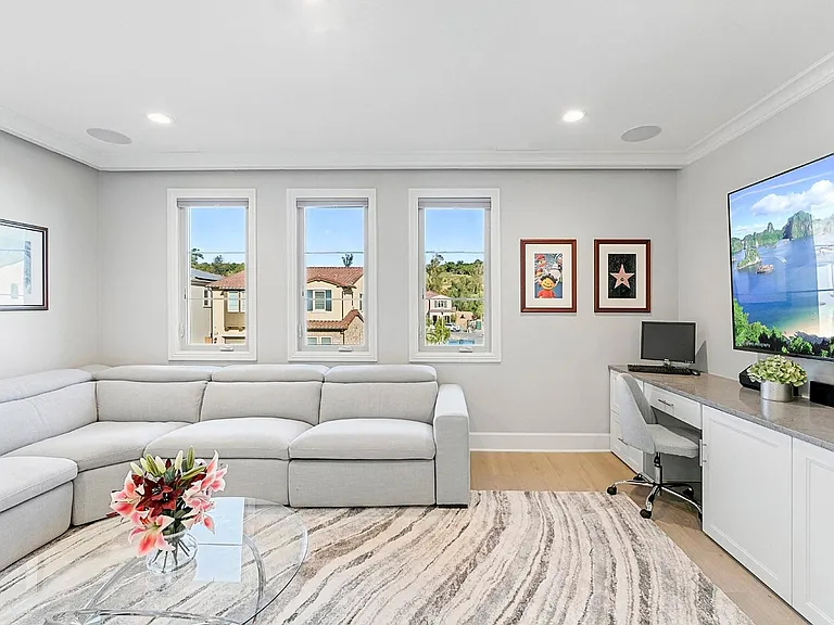"A Movie Room with a view!!" You have a rare beautiful view of the Avocado Orchards! The perfect place to work from home during the day and enjoy movies at night with built in Surround sound speakers for the ultimate home theater experience!