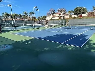 TWO LIT TENNIS COURTS