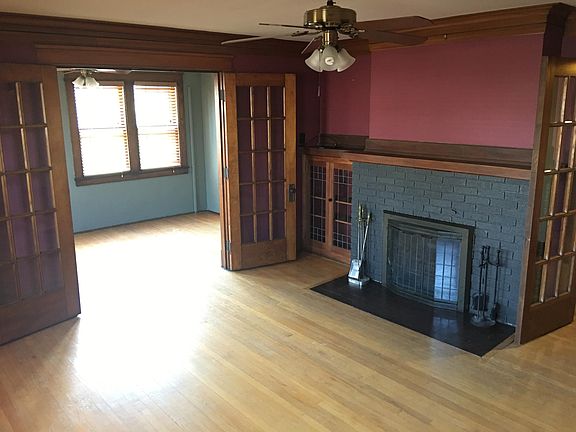 Living Room looking South to Sunroom - Working Fireplace