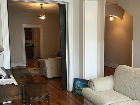 Another view of 1st room looking into 2nd room hallway and kitchen.
Front room is set up as living room.