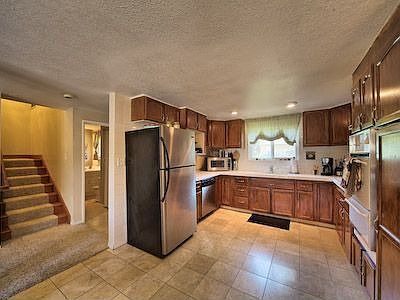Kitchen with marble flooring.