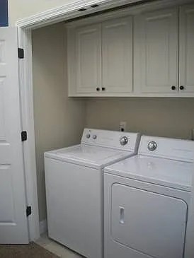 Hallway laundry closet in unit