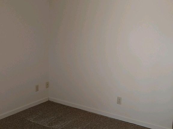 Living room with brand new carpet and cable/internet ready.