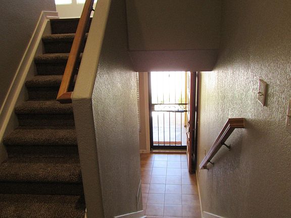 Entry and stairs to Den and Main Living Floor