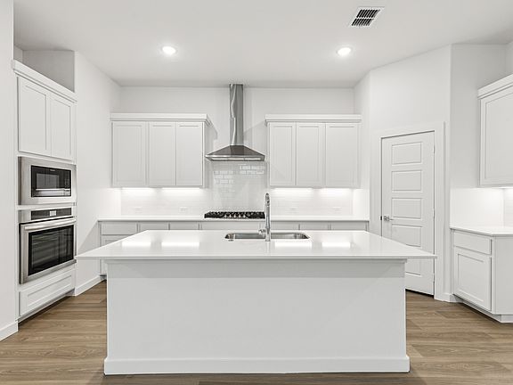 Kitchen in the Picasso II home plan by Trophy Signature Homes - REPRESENTATIVE PHOTO