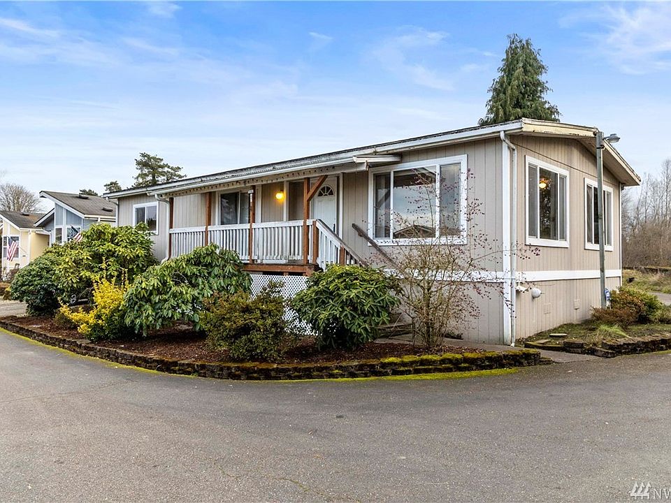 This cozy home is tucked at the end of the street in a 55+ community where you own your land