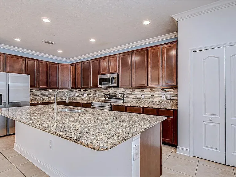 Note: Kitchen accent wall has since been professionally repainted to match the updated interior color scheme. Updated photos coming soon.