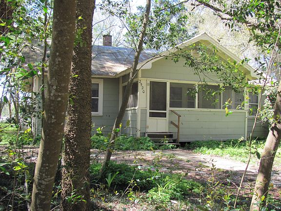 Front of Farm Home With Screened In Front Porch