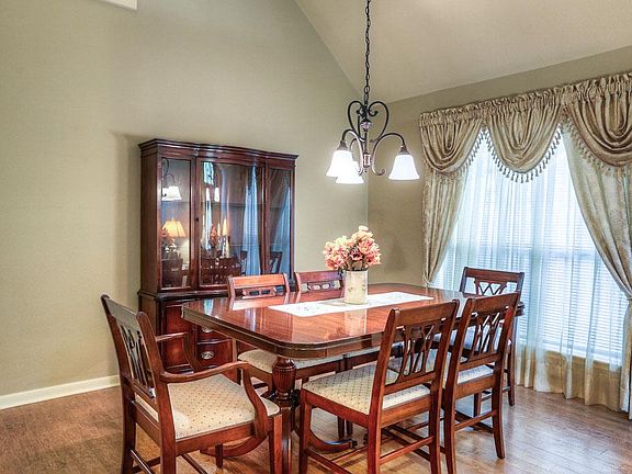 Large formal dining room has plenty of space for table and china cabinets.