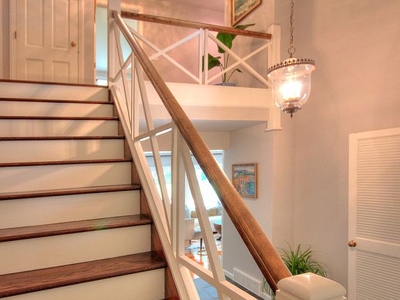 Slate floors and and an impressive stairway  greet you upon entering the main foyer. 