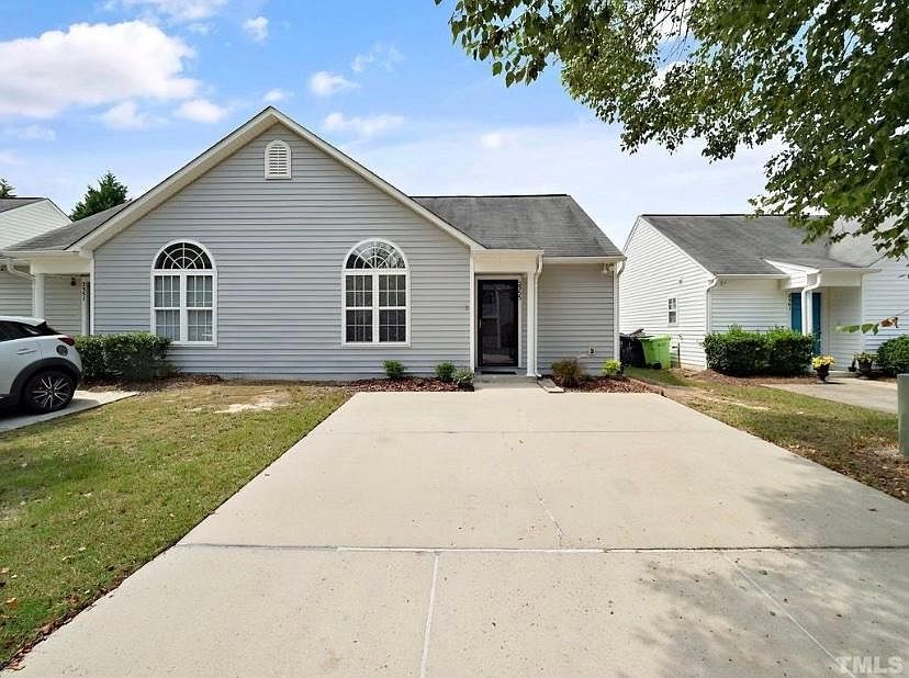 One level townhome/duplex. Parking pad for 2 cars.
