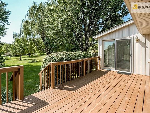 Deck leads to the beautiful back yard or to the 4-season sunroom.