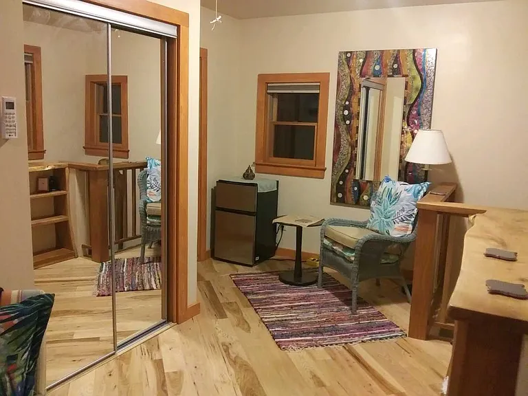 Other side of upstairs with built-in bookcase. Great for a reading nook or yoga area.