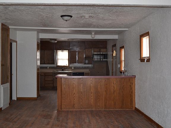 Across living room to kitchen