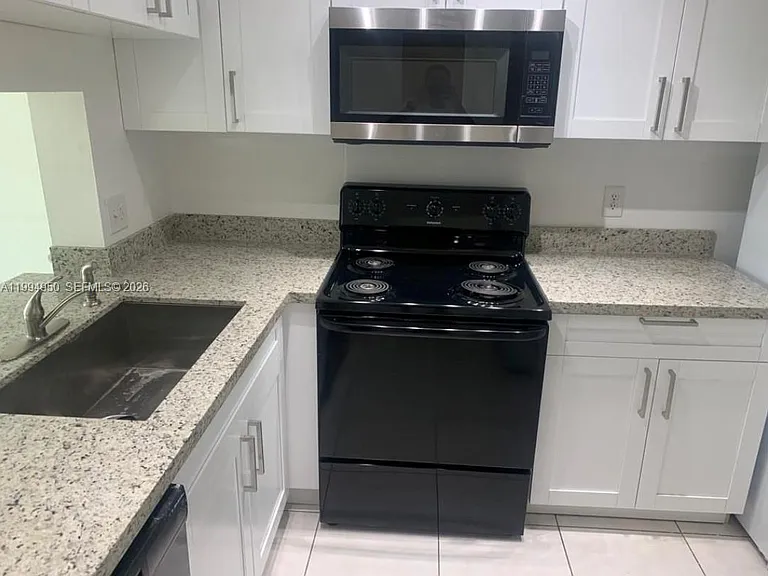 7435 Woodmont Ter #202 — Photo 9