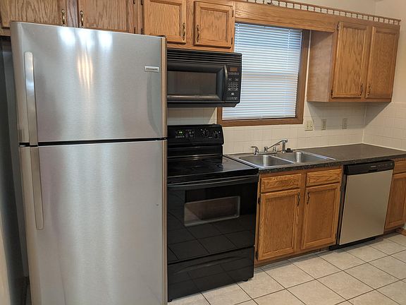 Kitchen with new stainless fridge and dishwasher!