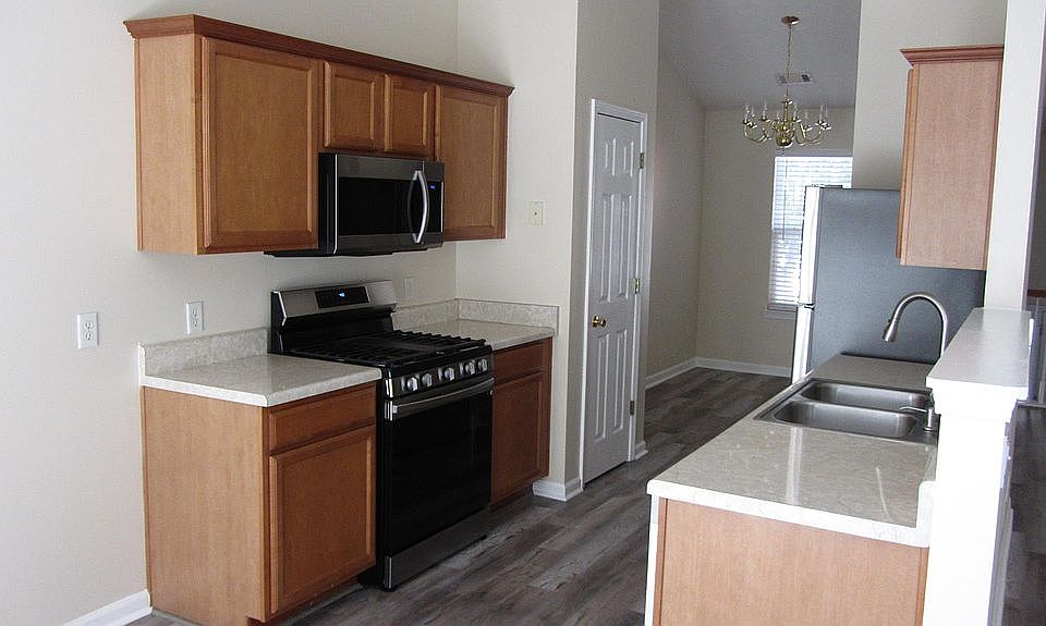 kitchen and dining room from breakfast area which is adjacent to the elevated deck.
