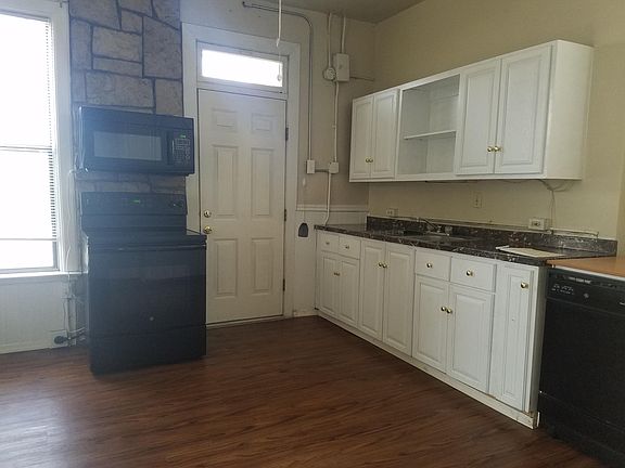 Kitchen with a door to the backyard