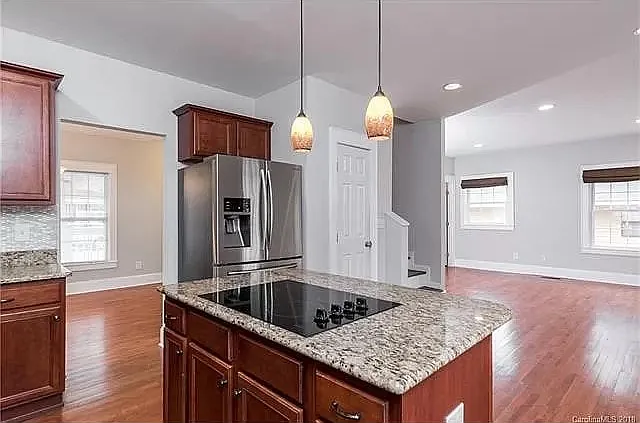Open concept kitchen to living and dining